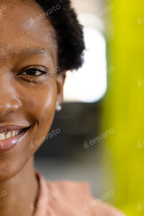 Preview: Closeup portrait of african american female architect looking at camera confidently in office