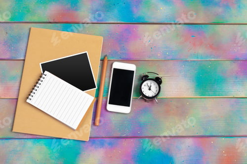 Preview: smartphone, tablet, notebook pen on the background of a wooden table