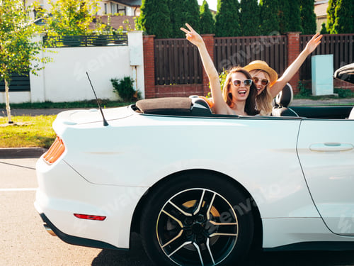 Preview: Two beautiful women enjoying summer days with cabriolet