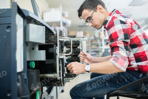 Preview: Casual man working with printing machine