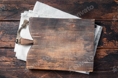 Preview: Directly Above view Of Cutting Board On dark Wooden Table. Wooden background. Top view. Copy space