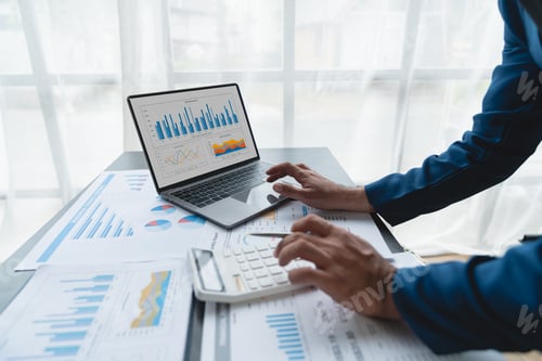 Preview: Confident businessman analyzing Calculate and view chart data from documents. financial report graph