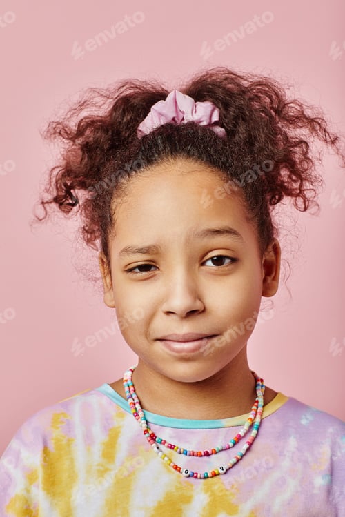 Preview: African American girl with necklace looking at camera on pink background