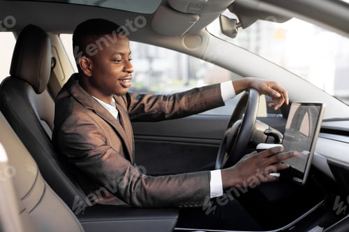 Preview: Smiling African American young businessman, dirnking coffee to go during break