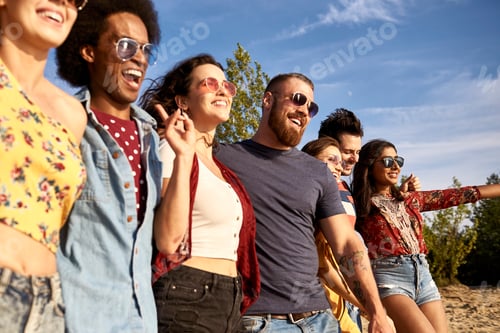 Preview: Happy young people in a row on the fresh air