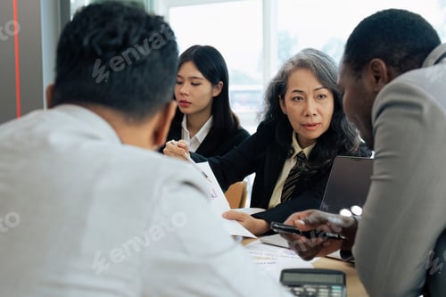 Preview: Female senior businessman brainstorming about marketing strategy report with diverse coworkers team
