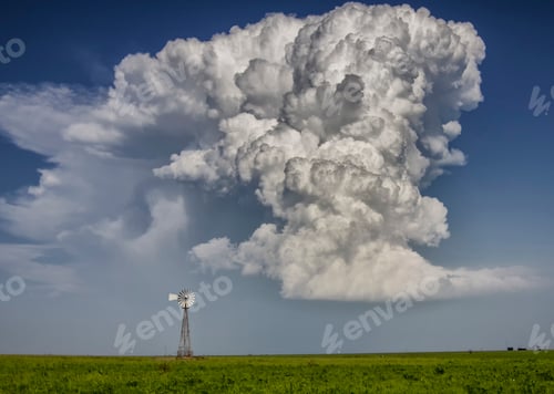 Preview: Supercell cloud over windmill on fertile plain