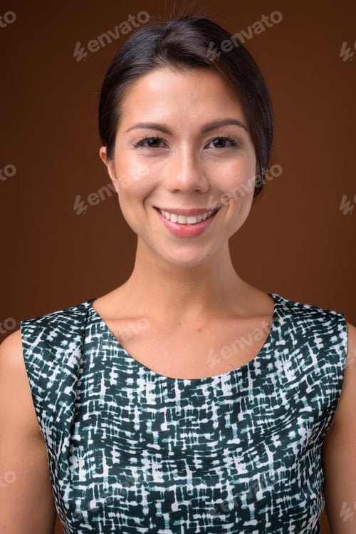Preview: Portrait of beautiful multi ethnic businesswoman with hair tied
