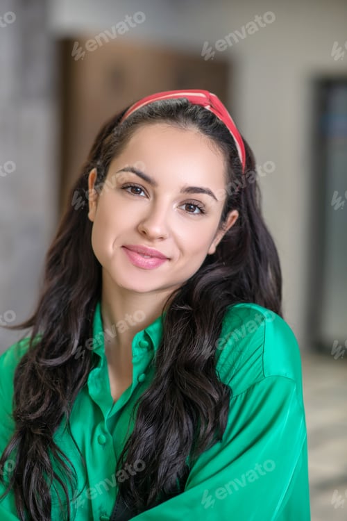 Preview: Young woman with long dark hair and brown eyes.