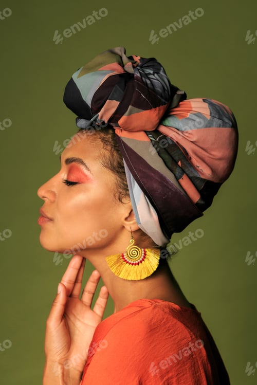 Preview: Beauty portrait ofStylish woman with colorful turban in studio.