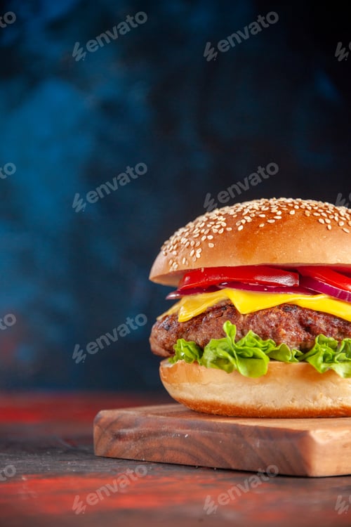 Preview: front view delicious cheeseburger with meat tomatoes and green salad on dark background sandwich