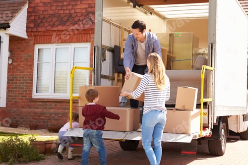 Preview: Family Unpacking Moving In Boxes From Removal Truck