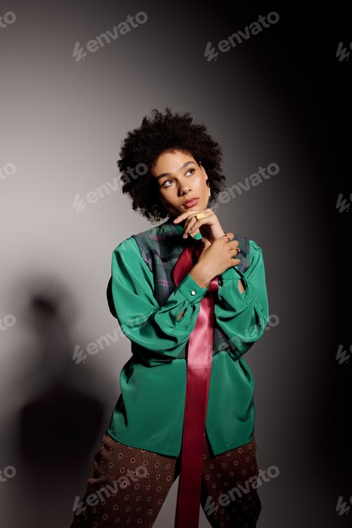Preview: Stylish young woman poses elegantly with confidence in a chic fashion setting