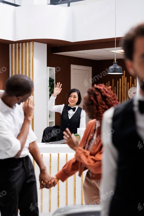 Preview: Couple saying goodbye to hotel employee