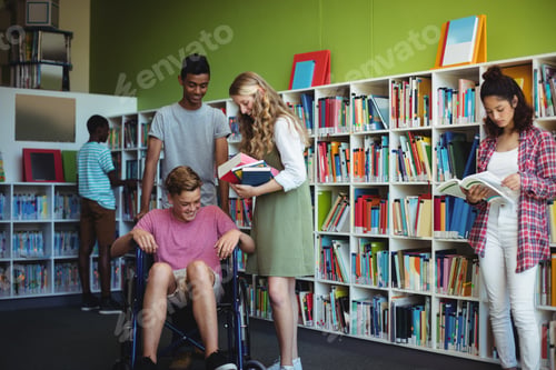 Preview: Students interacting with each other in library