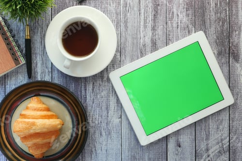 Preview: top view of digital tablet with office suppliers on table
