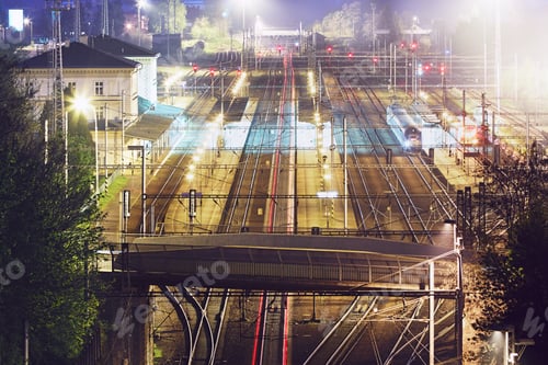 Preview: Red tail lights of the express train in railway station at night. Chocen, Czech Republic