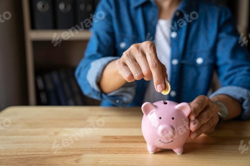 Preview: woman holds a coin in a pig-shaped piggy bank to save money for the future. after retirement and rec