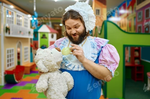 Preview: Cute funny man baby feeding teddy bear toy