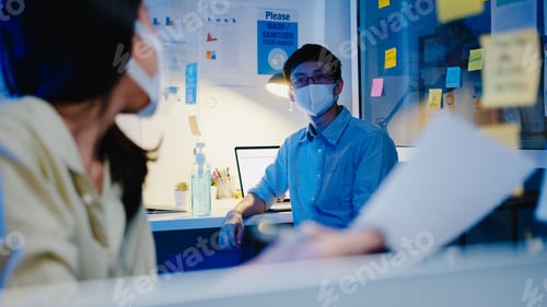 Preview: Happy Asia businesswoman in new normal while discussing business brainstorm meeting in office night