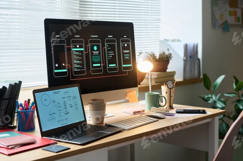 Preview: Man Working on Mobile App Design at Modern Office Desk