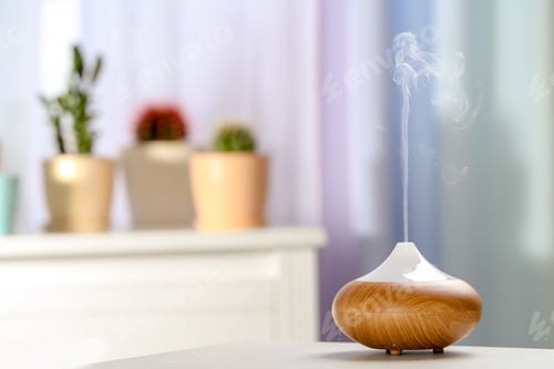 Preview: Aroma oil diffuser on table in room. Air freshener