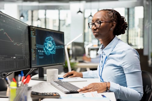 Preview: Trader in office using artificial intelligence for instant market analysis