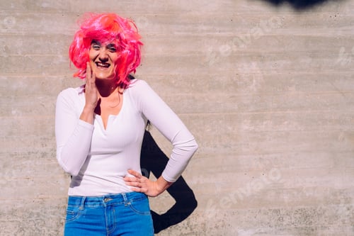 Preview: Slender and ugly woman with colorful wig posing ridiculously.