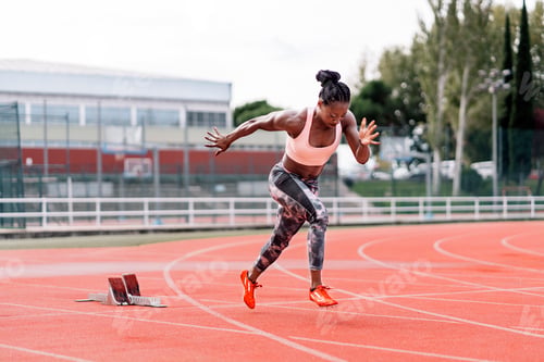 Preview: Young beautiful athlete sprinter running