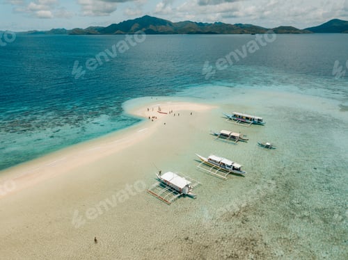 Preview: Aerial shot of the boats on the calm crystal clear ocean