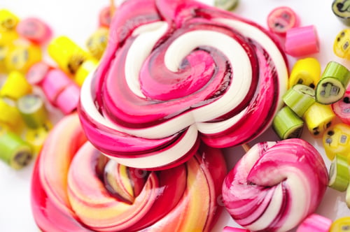 Preview: Colorful candies and lollipops on a white background