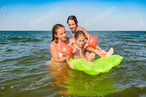 Preview: Happy mother and two small positive daughters