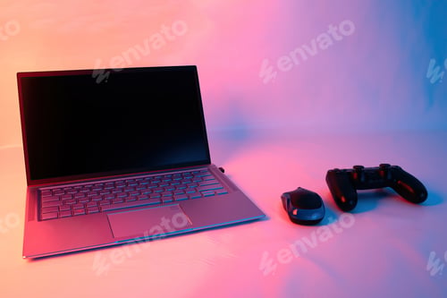 Preview: Closeup shot of a gaming console near a laptop