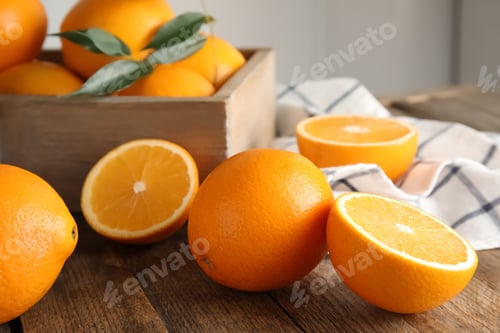 Preview: Fresh juicy oranges on wooden table. Healthy fruits