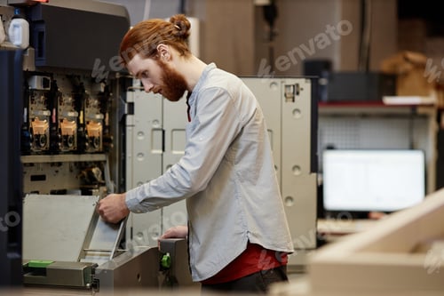 Preview: Man Using Printing Machine