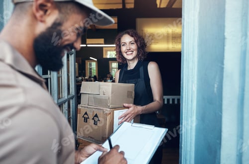 Preview: Shot of an attractive young hairdresser receiving a delivery from the courier at her salon