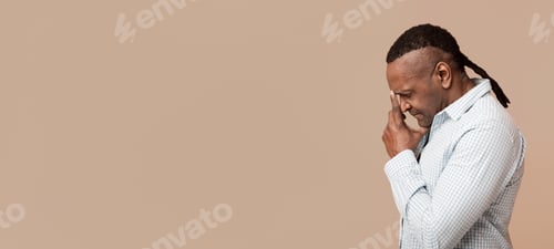 Preview: Pensive mature african american man deep in thoughts