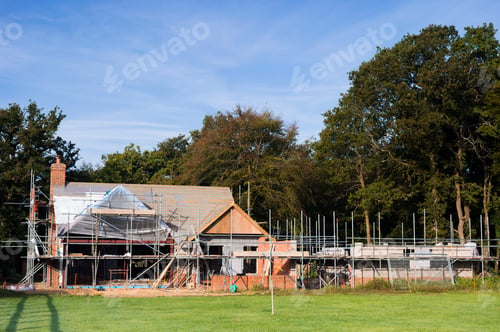 Preview: A family home under construction. A building site with scaffolding.