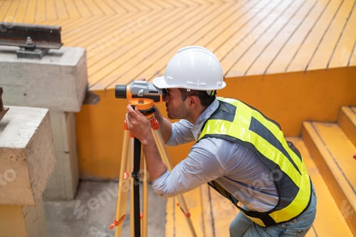 Preview: Engineer uses equipment to survey the level of railroad tracks in a maintenance plant.