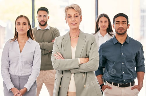 Preview: We make a powerful team. Shot of a diverse group of businesspeople standing together in the office.