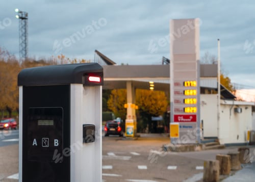 Preview: Charging point for electric cars with a gas station in the background