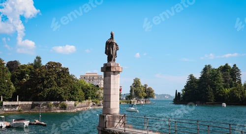 Preview: Statue overlooking Lake Maggiore in Verbania Italy on a sunny day by the waterfront