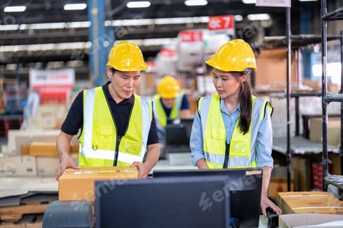 Preview: Staff working in large depot storage warehouse trainee check packing box and scan at cashier counter