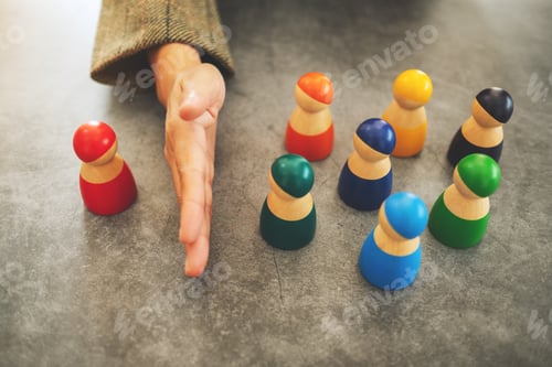 Preview: Concept image of a business woman separate one wooden people from a group