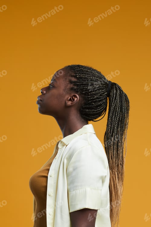 Preview: Profile View of African American Woman on Yellow