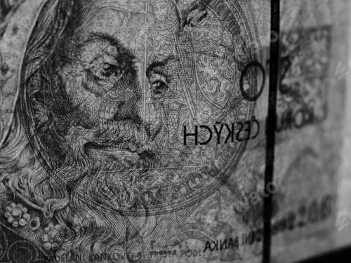 Preview: Closeup black and white shot of a Czech banknote of a hundred koruna with King Korel on it
