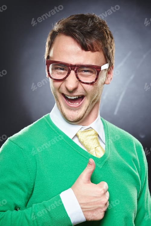 Preview: Nerd young man showing thumbs up