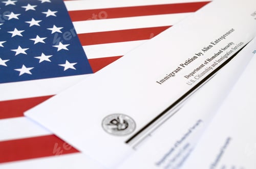 Preview: I-526 Immigrant Petition by Alien Entrepreneur blank form lies on United States flag with envelope