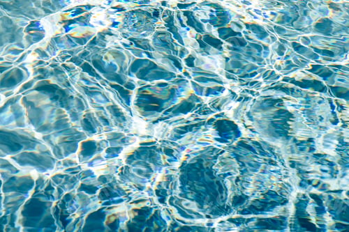 Preview: Poolside and blue water of pool