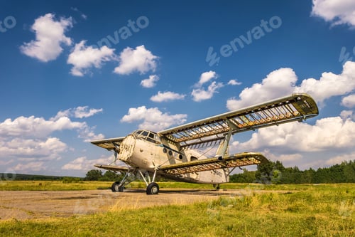 Preview: Old destroyed plane in the field on a sunny day